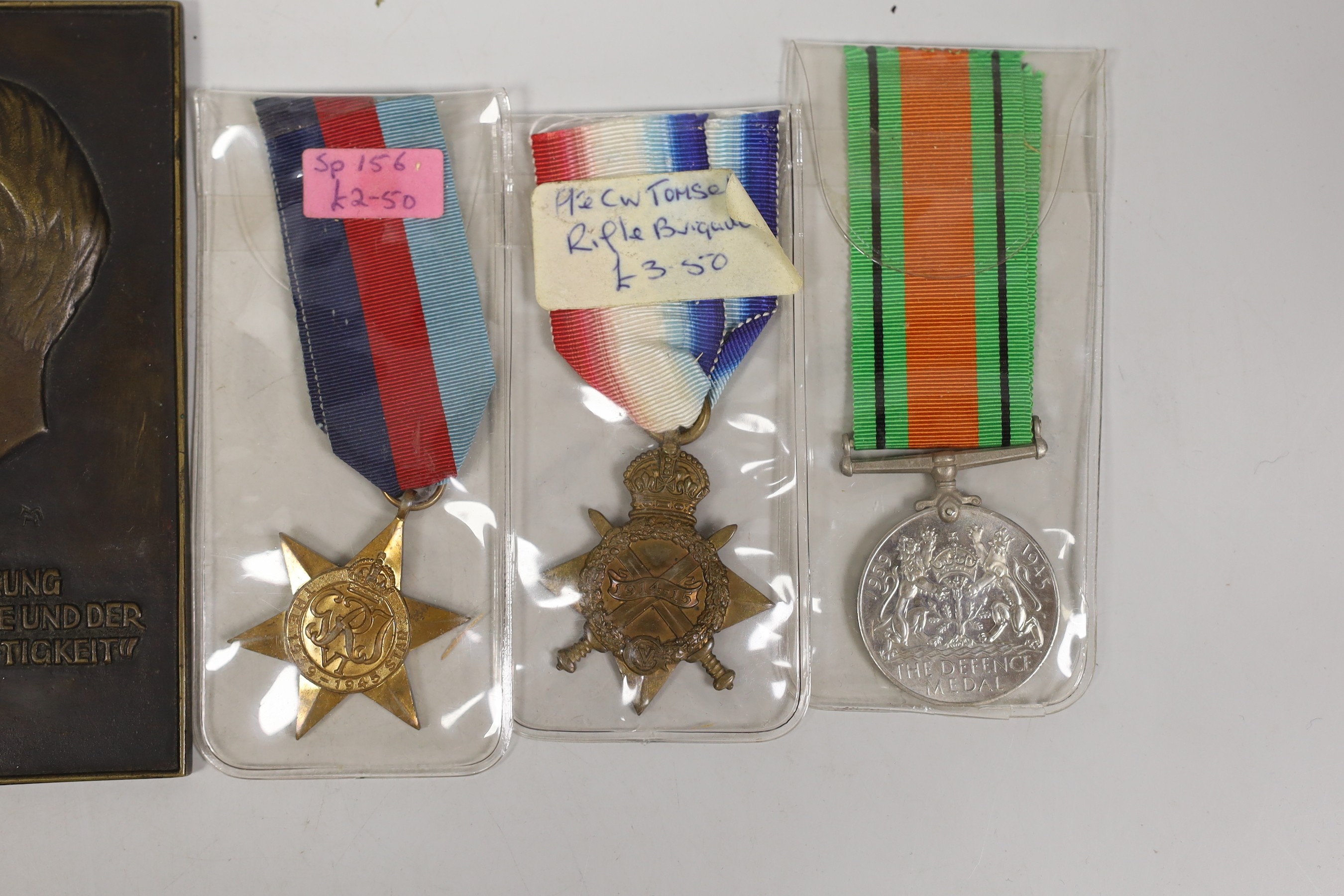 Two WWI medals, other medals and an Adolf Hitler bronze plaque